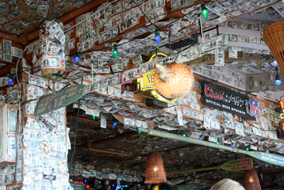 A Lot of people have stapled a dollar bill to the wall, ceiling, etc., after they wrote something profound on it. Lulu's money decor