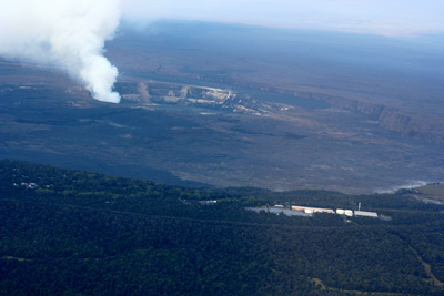 Kilauea from the air. The main crater takes up most of this picture. The steaming crater is a smaller crater inside the huge one. Kilauea